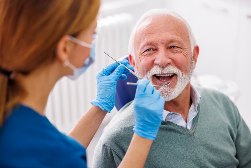 an older man visiting the dentist’s office