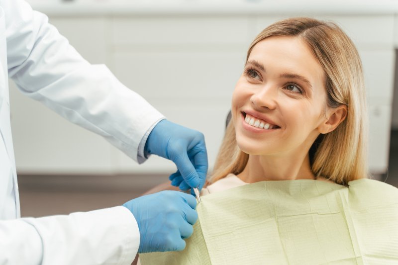 young woman smiling at the dentist